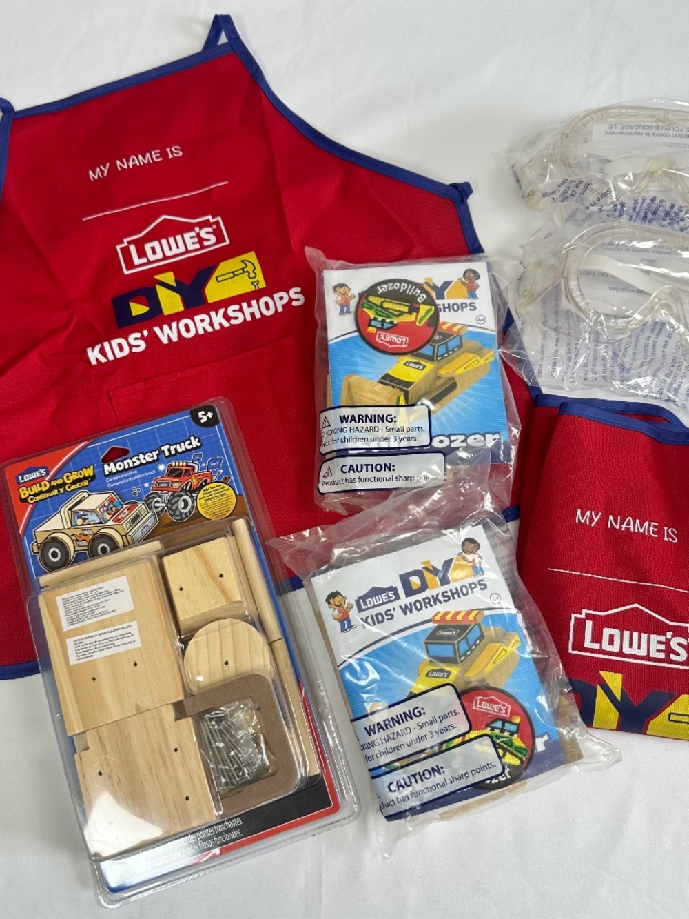 Kid's Lowe's Lot 2 Aprons 2 Bulldozer & 1 Monster Truck Kits 2 Safety Glasses